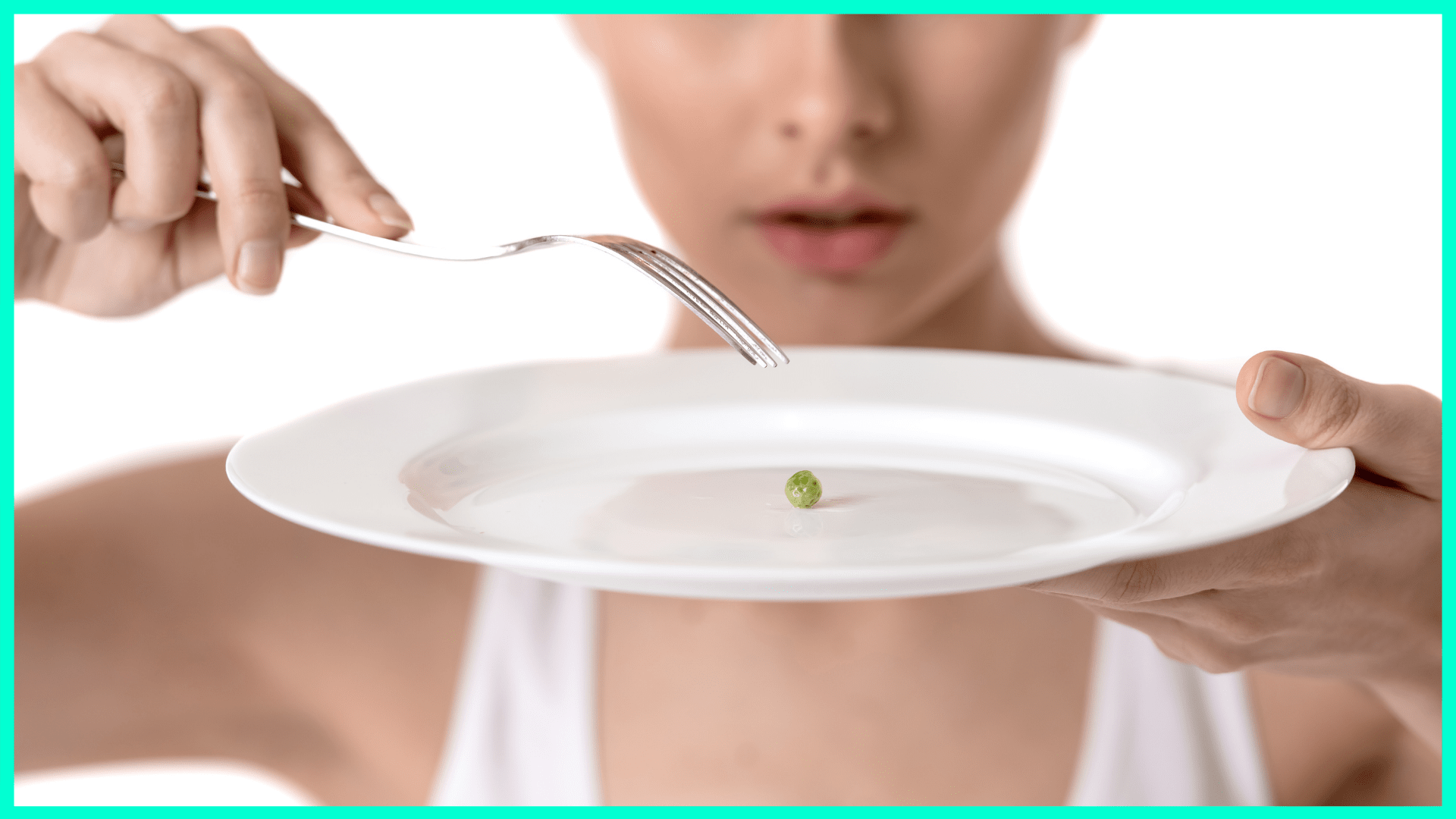 big plate with one tiny pea on it being stabbed by fork